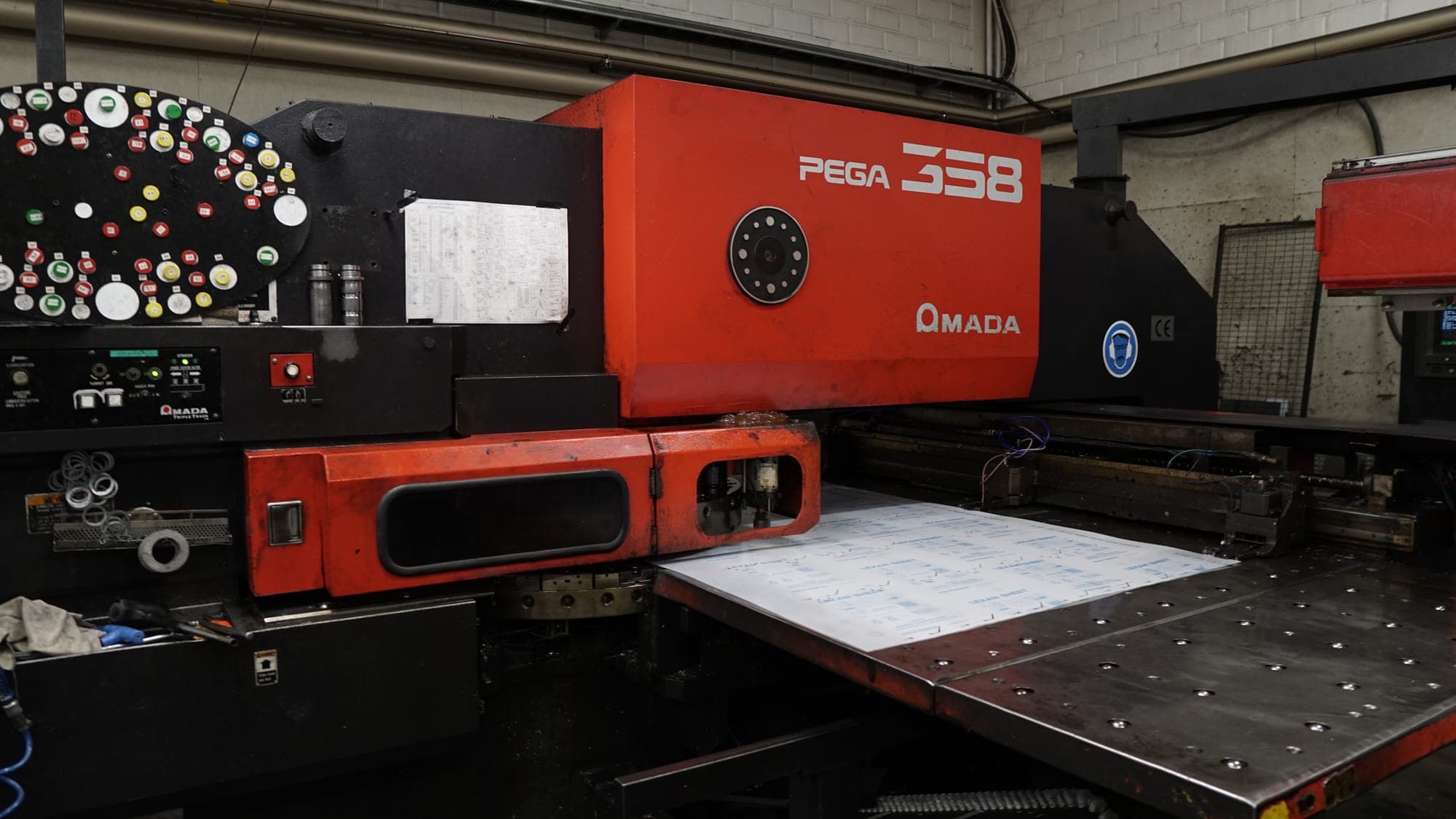 Amada Pega 358 sheet metal working centre with a sheet on the table
